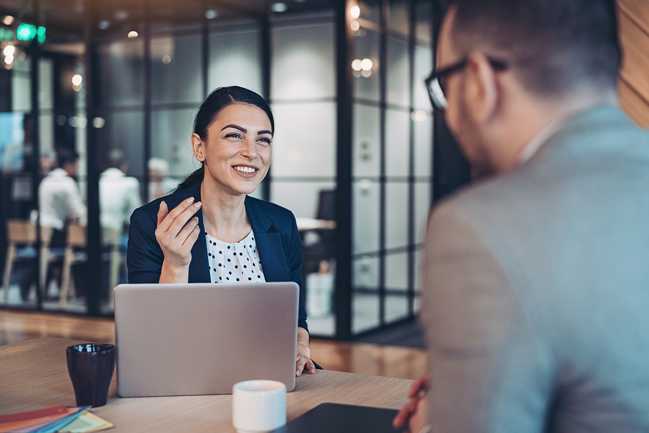 Business persons talking in the office